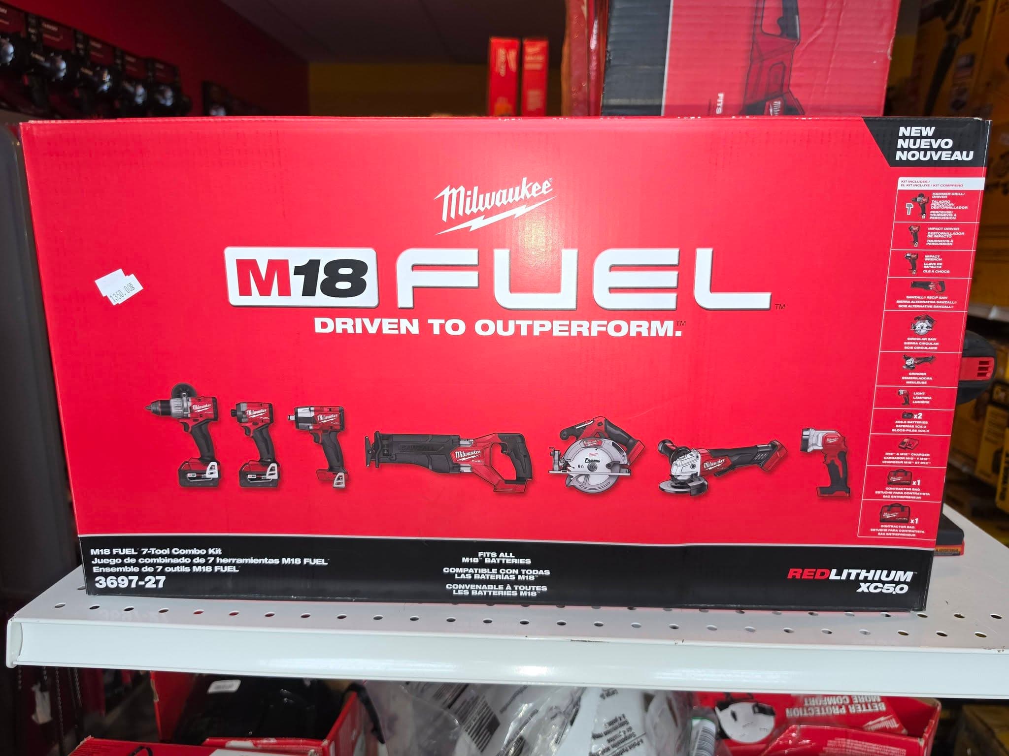 Milwaukee M18 FUEL 7-Tool combo kit box on a shelf displaying cordless power tools.